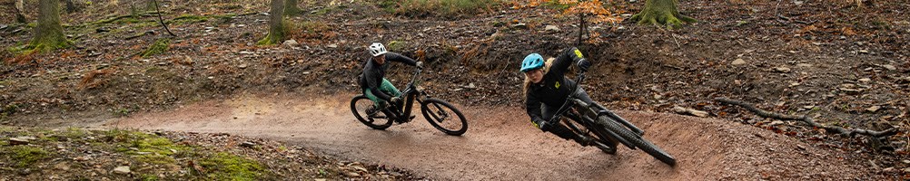 Two riders on merida bikes in forest of dean
